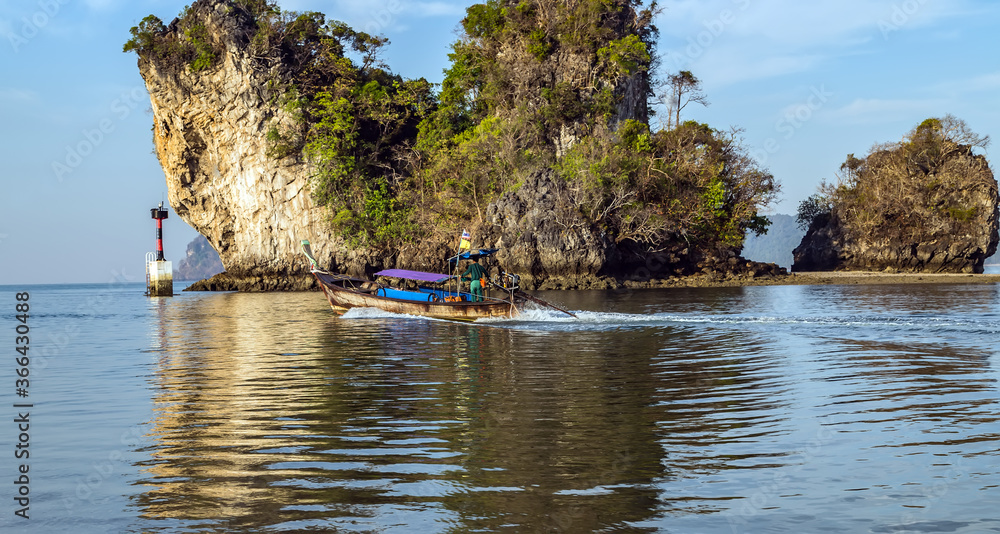 Thai traditional wooden longtail boat Limestone karst rocks Thai traditional wooden longtail boat Limestone karst rocks