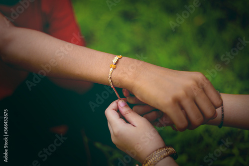 brother and sister hands  celebrating raksha bandhan festival 
