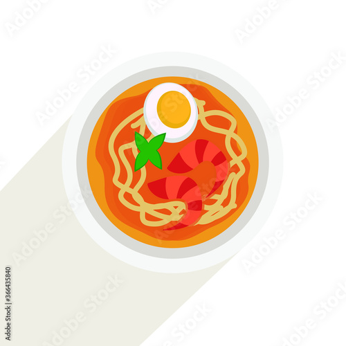 Laksa soup with noodles shrimps fish egg chopsticks spoon bamboo leaf traditional asian cuisine food dish