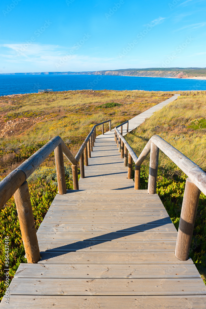 wooden boardwalk downwards to the atlantic coast, costa vicentina Portugal