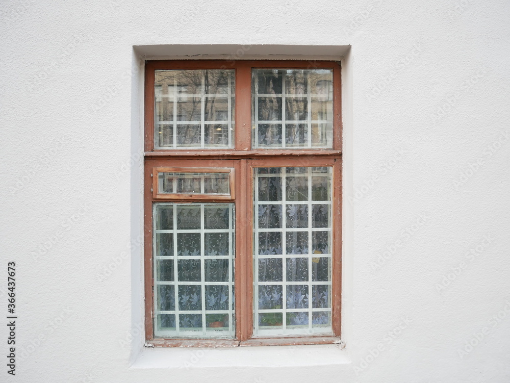 Dirty wooden window with metal grid. Dirty wooden window with metal grid.