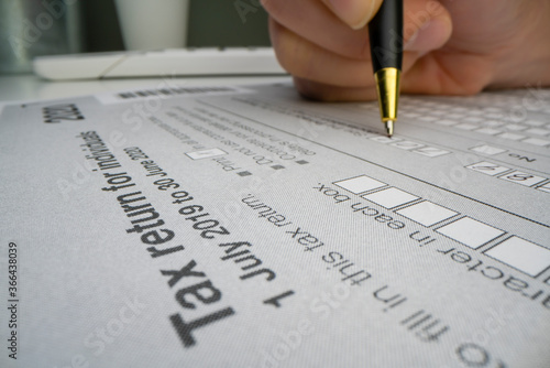 Close-up view of completing Australian tax form photo