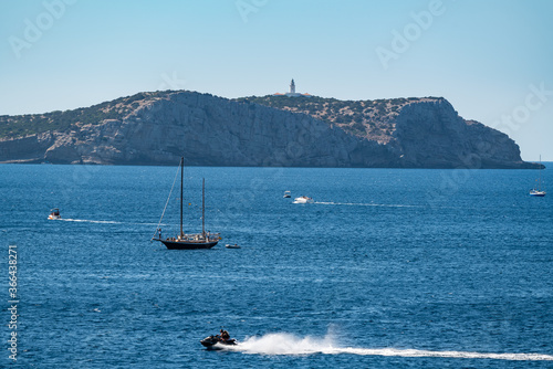 Boat and jet sky in the Mediterranean Sea, Ibiza. Spain.