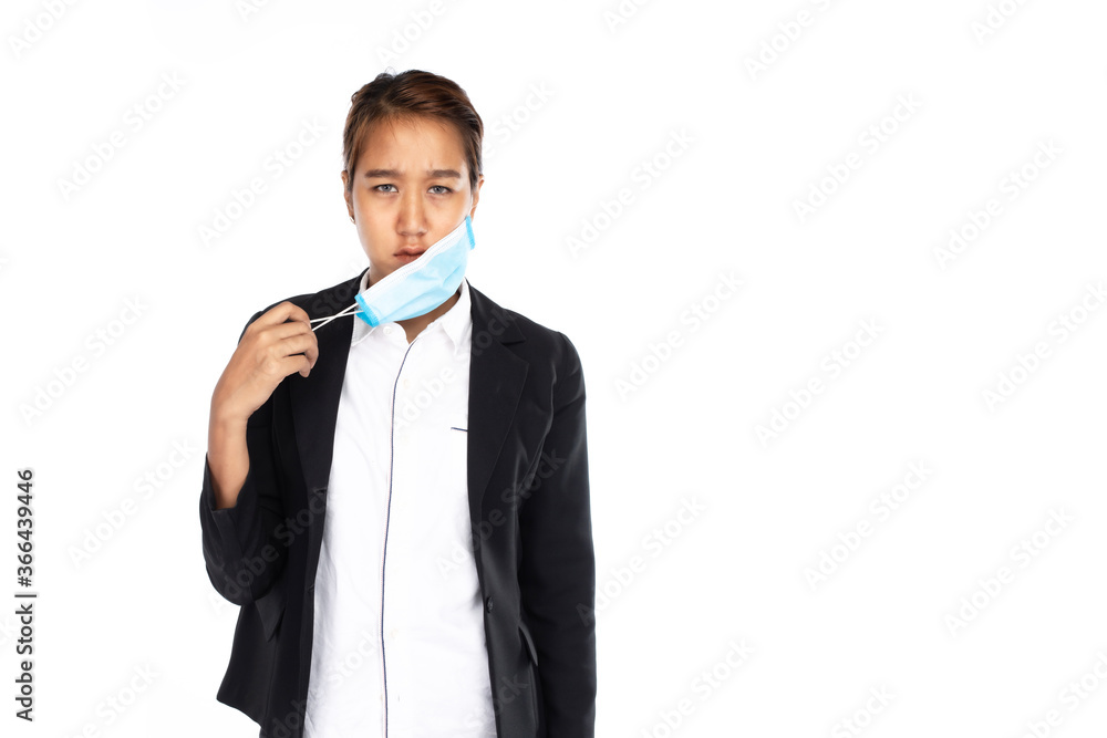 Asian businesswoman in serious face take off surgical face mask by one hand in black suit jacket, feel bad look at camera, studio light isolated on white background, coronavirus, COVID-19 concept Asian businesswoman in serious face take off surgical face mask by one hand in black suit jacket, feel bad look at camera, studio light isolated on white background, coronavirus, COVID-19 concept