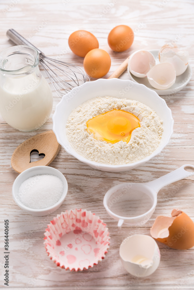Assortment of basic baking ingredients for cake, muffins or pancakes Assortment of basic baking ingredients for cake, muffins or pancakes