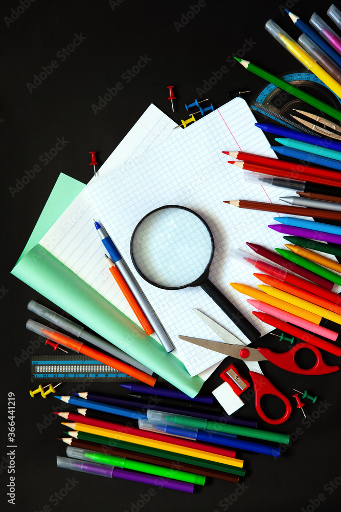 School supplies, office supplies on a black background. Flat lay style School supplies, office supplies on a black background. Flat lay style