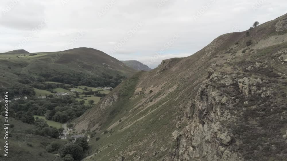 Capelulo Penmaenmawr rise above Welsh mountain summit coastal valley aerial view north wales Capelulo Penmaenmawr rise above Welsh mountain summit coastal valley aerial view north wales