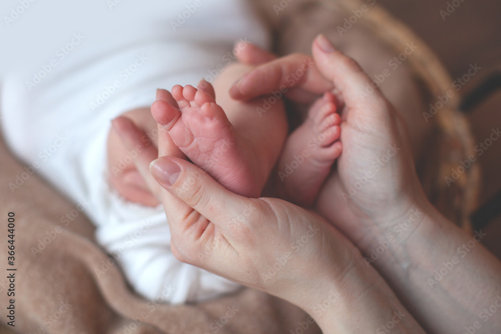 Newborn baby feet in father hands. Family concept. Props for little baby photoshoot. Newborn baby feet in father hands. Family concept. Props for little baby photoshoot.