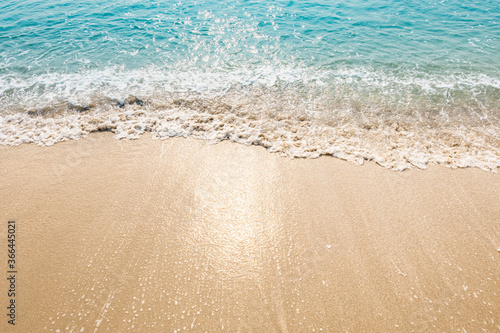 wave of blue ocean on sandy beach. texture Background. 