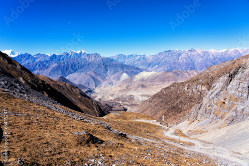 Panoramic views on a popular tourist destination trail in Nepal - Annapurna Circuit Trail. Way to base camp and Thorong La or Thorung La pass. Near Jharkot and Muktinath, Upper Mustang. photo