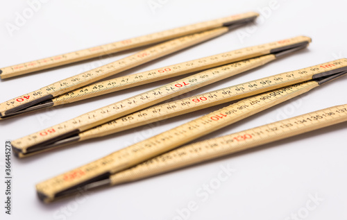 Wooden folding ruler isolated on a white background.