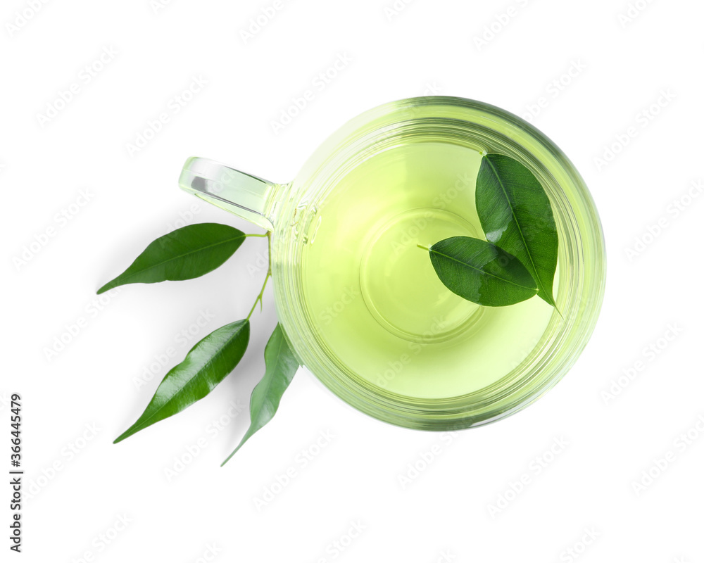 Cup of aromatic green tea and leaves isolated on white, top view