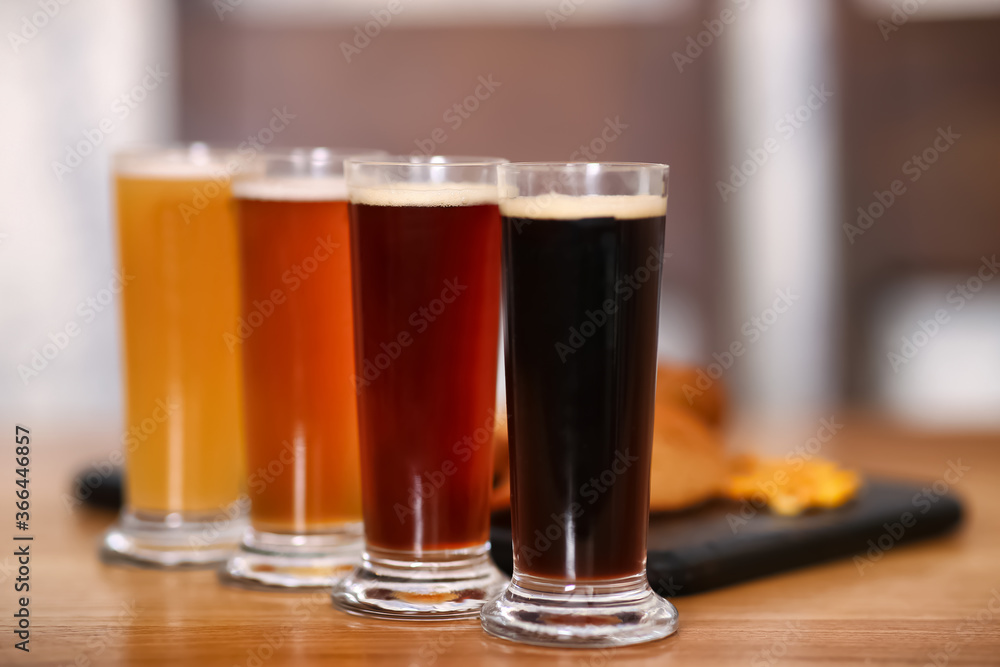 Beer tasting set served on wooden table Beer tasting set served on wooden table
