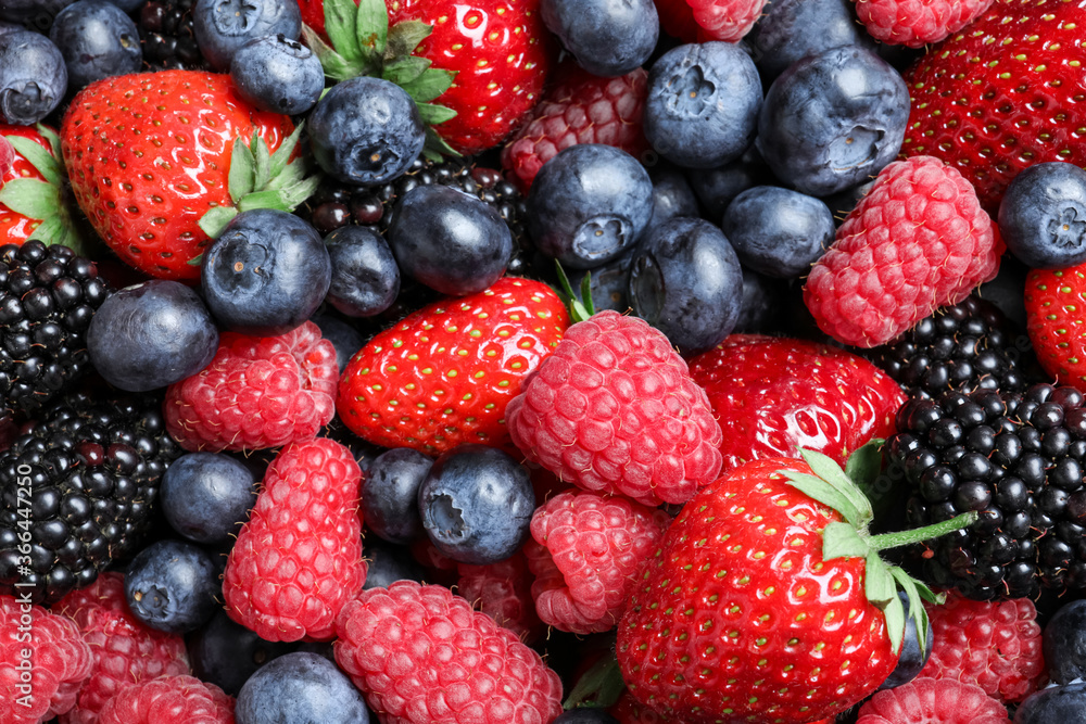 Mix of different ripe tasty berries as background, top view Mix of different ripe tasty berries as background, top view