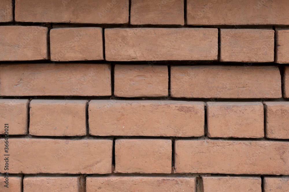 Brick wall of a building. Textured background. Brick wall of a building. Textured background.