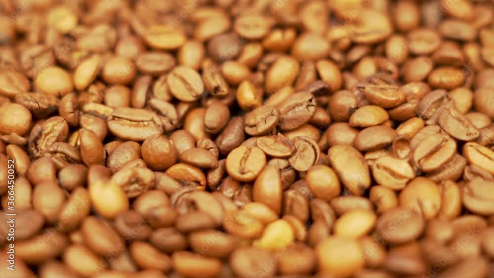 Useful Selected Grains Of Natural Aromatic Coffee. Coffee beans Isolated Close-up. Rotation Useful Selected Grains Of Natural Aromatic Coffee. Coffee beans Isolated Close-up. Rotation