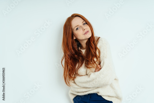 Young woman giving the camera a careful look