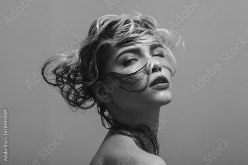 Fashion studio portrait of woman with creative hairstyle