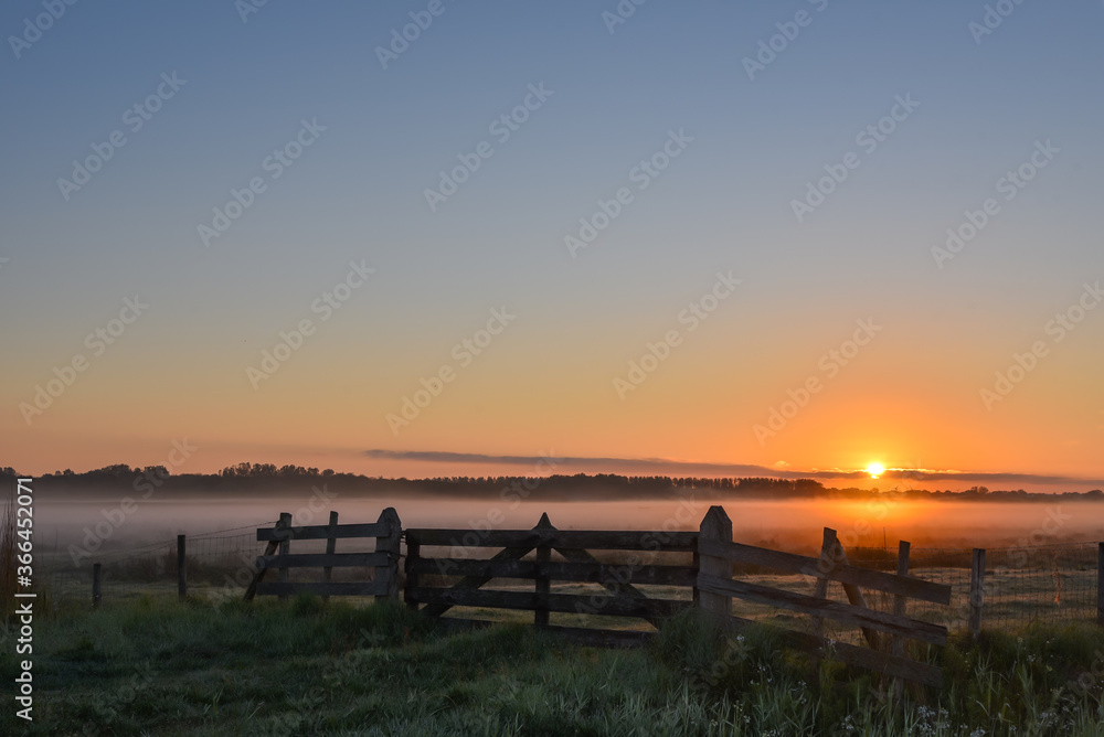 Rising sun over the wet lands of Den Helder