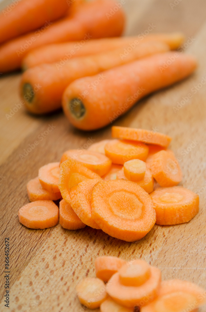 fresh carrots on a wooden table