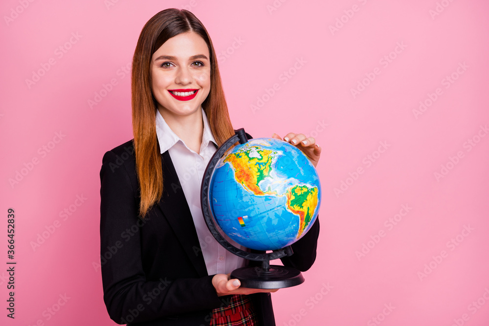 Close-up portrait of her she nice attractive lovely pretty charming cheerful content intelligent red-haired schoolgirl nerd holding in hands globe isolated on pink pastel color background Close-up portrait of her she nice attractive lovely pretty charming cheerful content intelligent red-haired schoolgirl nerd holding in hands globe isolated on pink pastel color background