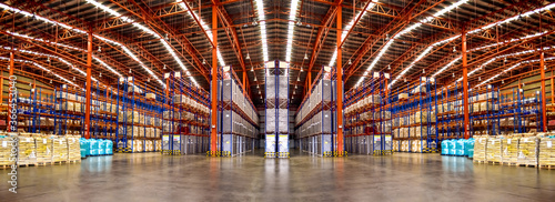 Warehouse industrial and logistics companies. Commercial warehouse. Huge distribution warehouse with high shelves. Bottom view. photo