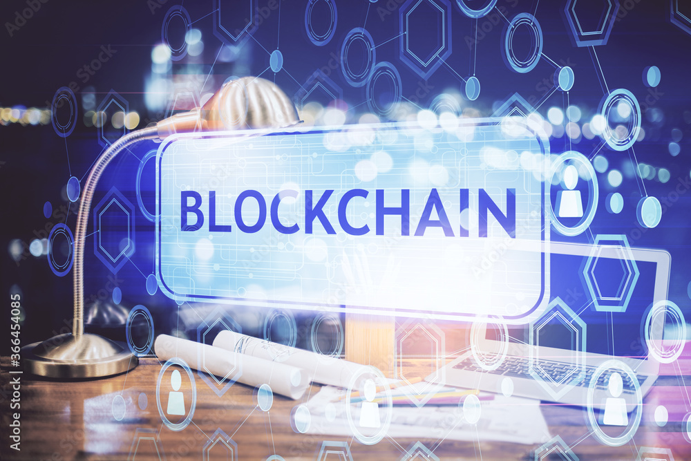 Double exposure of blockchain and crypto economy theme hologram and table with computer background. Concept of bitcoin cryptocurrency. Double exposure of blockchain and crypto economy theme hologram and table with computer background. Concept of bitcoin cryptocurrency.