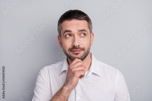 Close-up portrait of his he nice attractive minded mature man executive manager wearing white shirt overthinking choosing options isolated over light gray pastel color background