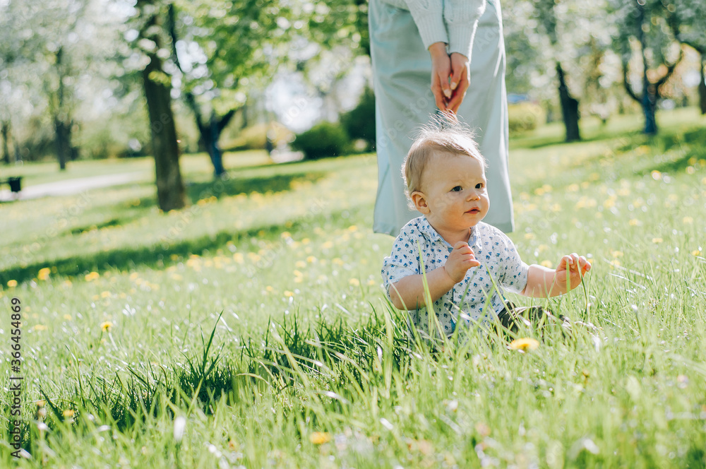 Beautiful young mother and child in the park. Happy mother's day.