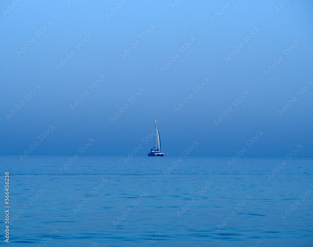 Sailboat in the blue sea