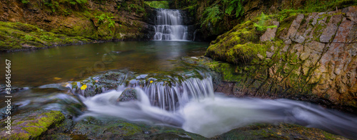 Fototapeta Naklejka Na Ścianę i Meble -  A panoramic of The Sychryd Cascades, (Sgydau Sychryd in Welsh) a set of waterfalls in the area called waterfall country near the Dinas Rock, Pontneddfechan, South Wales, UK