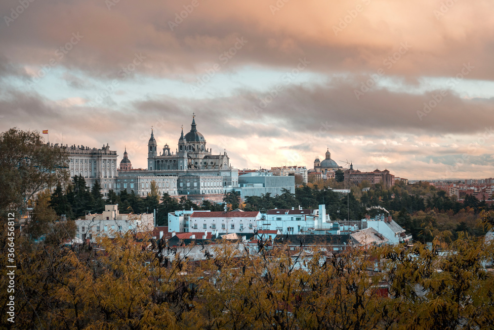 image of a sunset of the royal palace and the almudena cathedral in madrid