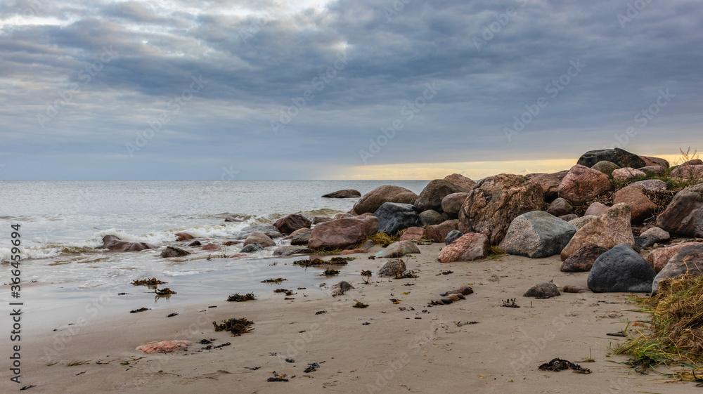The rocky shore of the Baltic Sea on an early, cloudy morning. Latvia, the Baltics