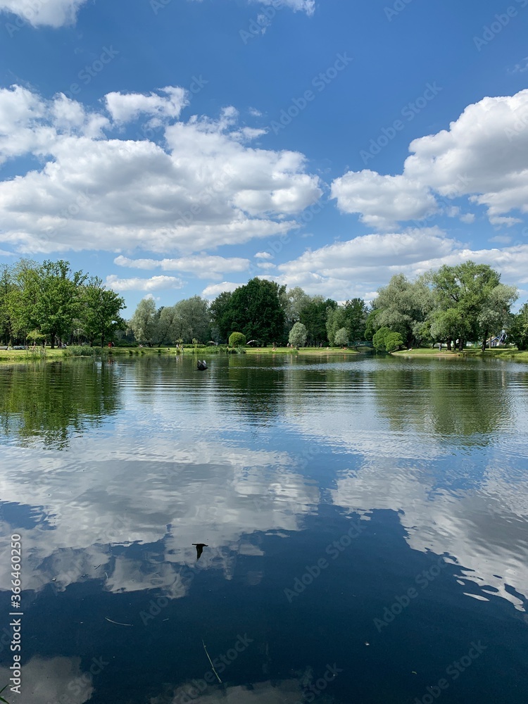 Fototapeta premium Clouds reflection in the lake water, natural colors, lake background