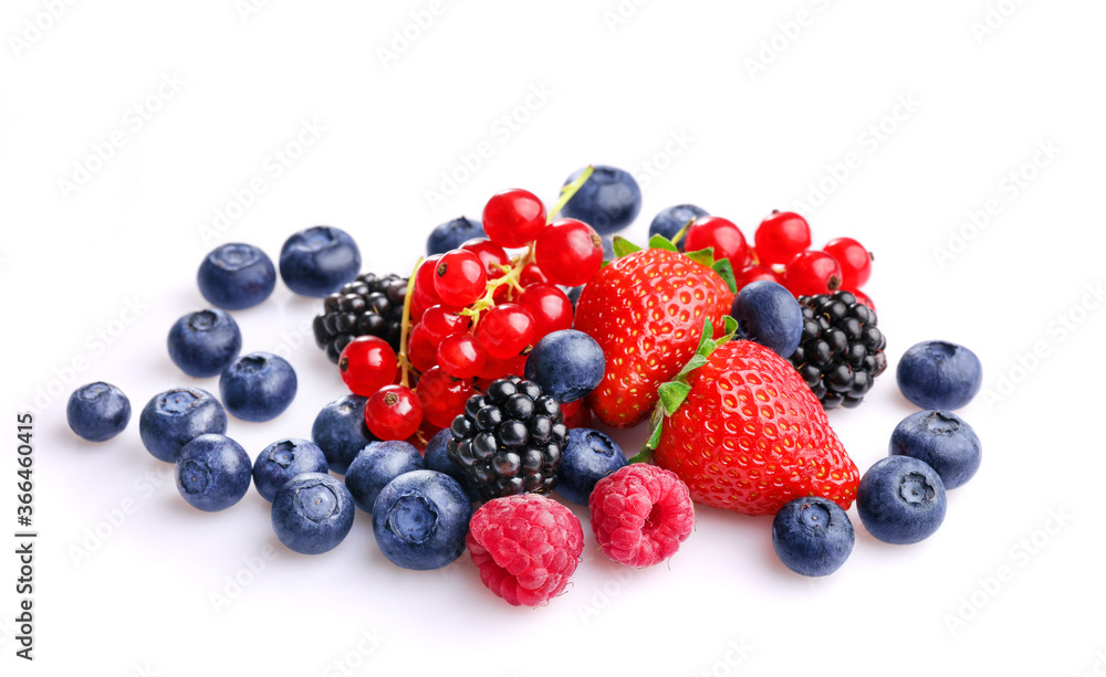Pile of assorted wild fresh berries isolated on white background.