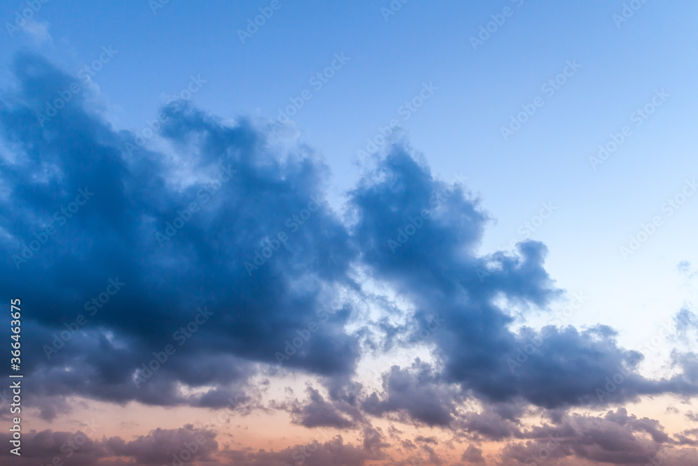 Fototapeta premium Dark clouds in the sky at sunset,