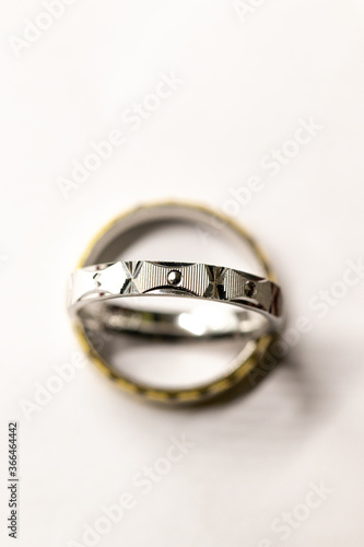 silver round ring on white background