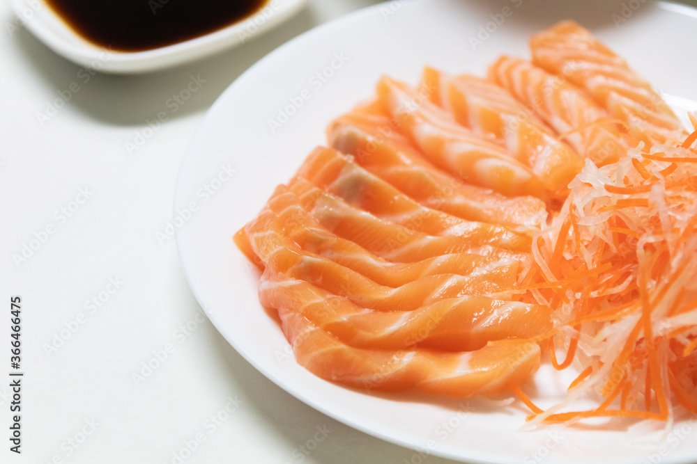 Fresh salmon sashimi serve on plate. Japanese food style. Fresh salmon sashimi serve on plate. Japanese food style.