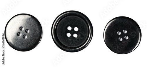 Black sewing buttons set and collection isolated on white background, top view