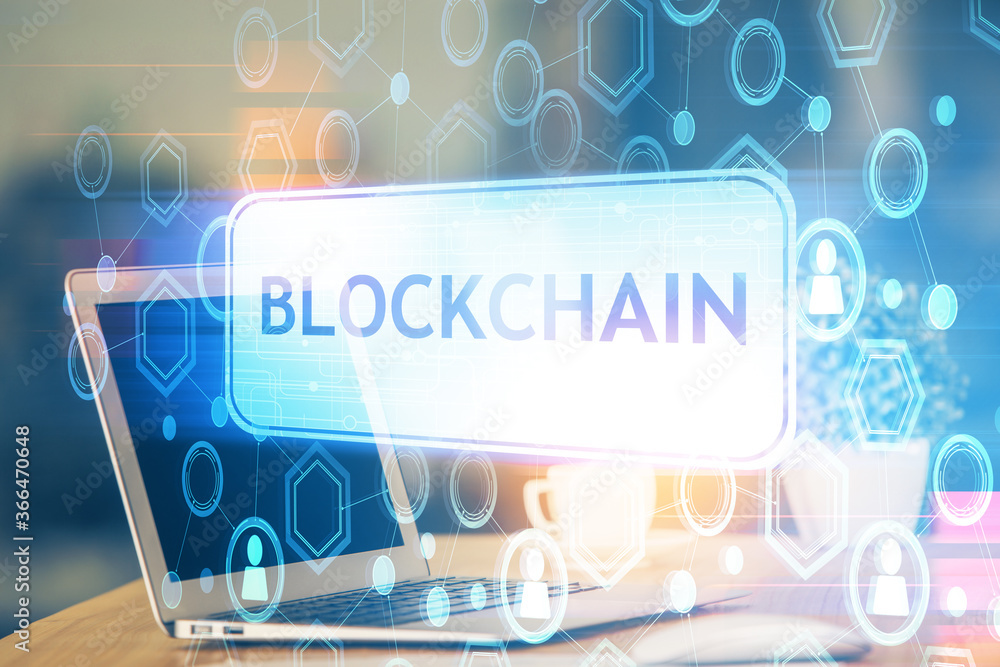 Multi exposure of blockchain theme hologram and table with computer background. Concept of bitcoin crypto currency. Multi exposure of blockchain theme hologram and table with computer background. Concept of bitcoin crypto currency.