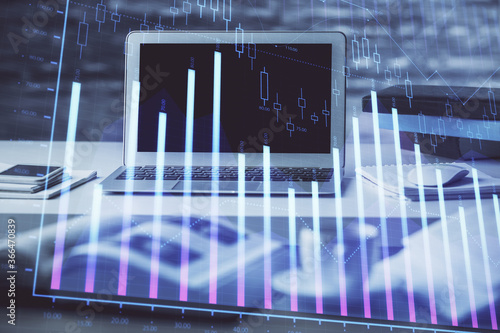 Stock market graph and table with computer background. Multi exposure. Concept of financial analysis. © peshkova