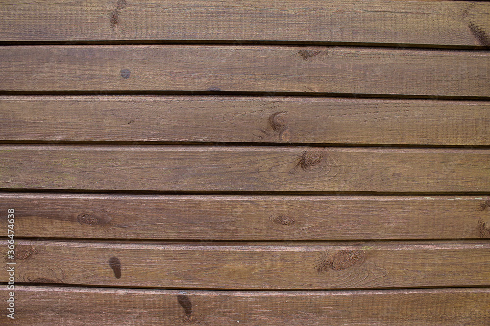 Obraz premium Texture of an old brown wooden wall. The slats are installed vertically.