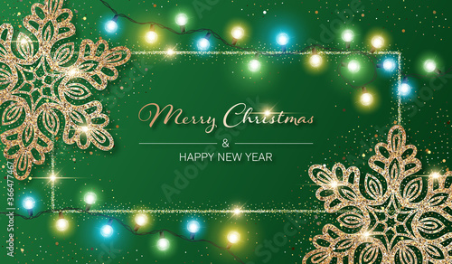 Christmas background with shiny snowflakes made of golden confetti and lights garlands. Design element for greeting card, party invitation or banner