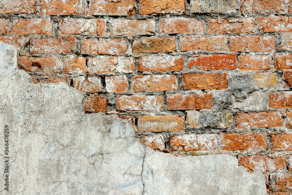 A wall of very old brick red-orange and brown with destruction. Texture