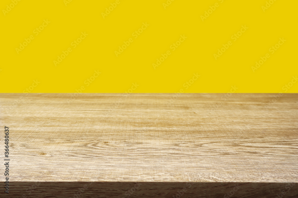 Wood table on yellow background. Wood table on yellow background.