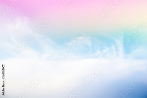 Fototapeta Naklejka Na Ścianę i Meble -  Dramatic panorama view of blurry beautiful soft white clouds and rainbow color gradient effect on blue sky background.