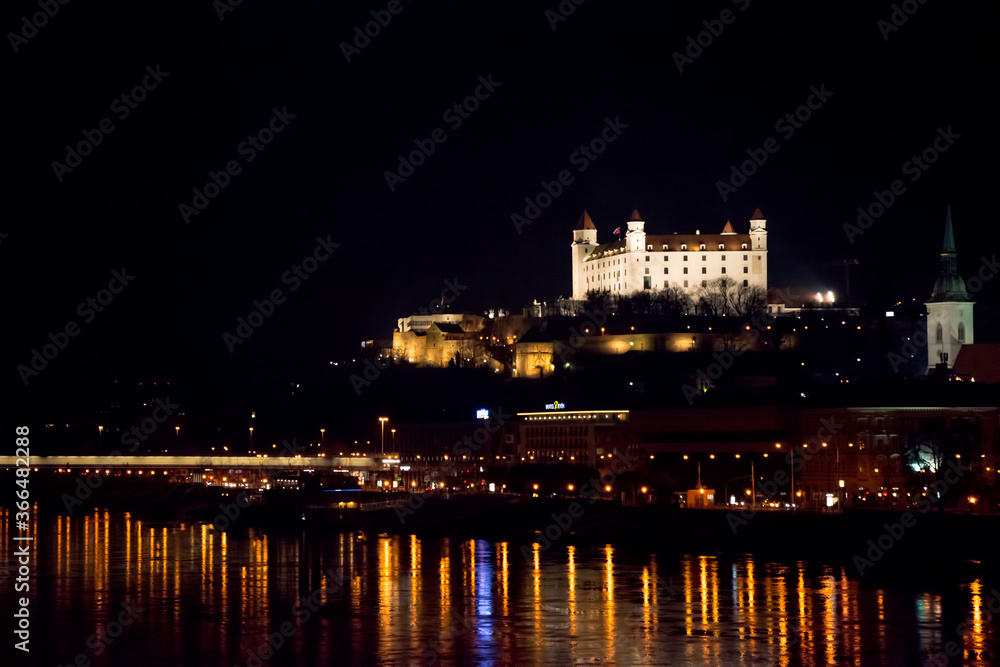 Bratislava castle on the Danube river at night