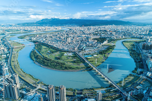 Taipei City Aerial View - Asia business concept image, panoramic modern cityscape building bird’s eye view under sunrise and morning blue bright sky, shot in Taipei, Taiwan. photo