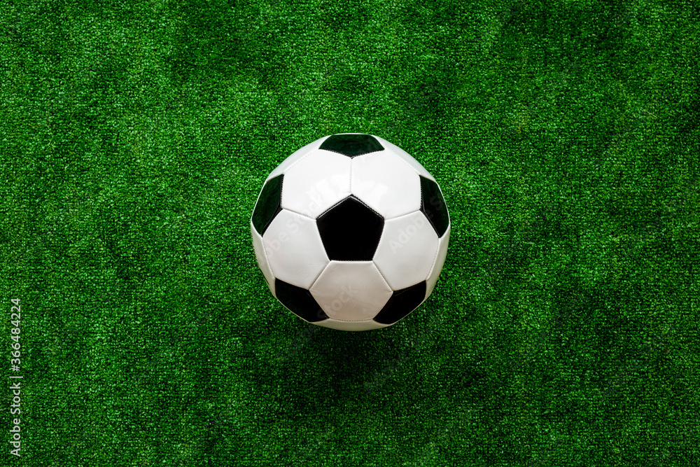 Soccer ball on green grass background top view copy space Soccer ball on green grass background top view copy space