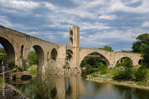 Medieval stone bridge over a river in Besalu, Catalonia famous touristic landmark